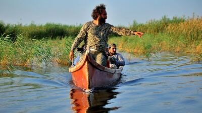 Iraqi environmentalist Omar Al Sheikhly leads a team into the marshes in search of endangered animals, in Chibayish. Without quick action, Mr Al Sheikhly fears the delicate underwater ecology of the Unesco-protected site will be disrupted. AP Photo