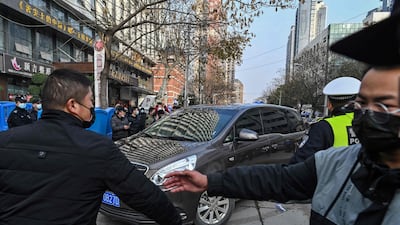 Members of the WHO team arrive at the Wuhan centre for disease control and prevention in Wuhan, China's central Hubei province. AFP