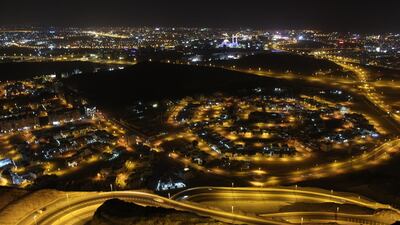 Oman's capital Muscat at night. The country will lift its coronavirus curfew but will ban overnight trading. Titus Varughese for The National