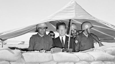 Dag Hammarskjold, seen here in Gaza spending Christmas with UN troops in December 1958, died on a contentious mission to war-torn Democratic Republic of Congo.