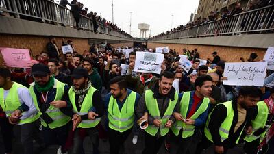 Iraqi university students chant slogans during a strike and protests in central Baghdad. EPA