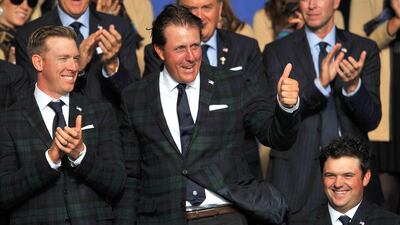 Phil Mickelson of the United States, centre, will be in action today when he and Keegan Bradley take on Sergio Garcia and Rory McIlroy. Glyn Kirk / AFP