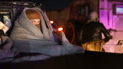 Members of the Kurdish-led Syrian Democratic Forces wrap up warm as they head towards Kobani after withdrawing from the outskirts of Raqqa city. AFP
