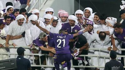 Al Ain’s Fawzi Fayez celebrates with the supporters. Karim Jaafar / AFP