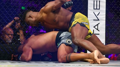 Francis Ngannou lands punches on Renan Ferreira during their heavyweight superfight title bout in Riyadh. Chris Whiteoak / The National