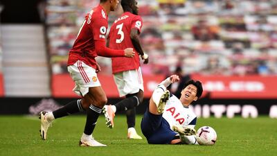 Son Heung-min goes down after being fouled by United defender Eric Bailly. Getty