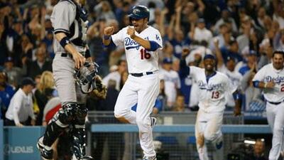 The Dodgers' Andre Ethier, second from left, celebrates as he runs towards home plate to score on an RBI single hit by Mark Ellis at the bottom of the ninth inning. Lucy Nicholson / Reuters