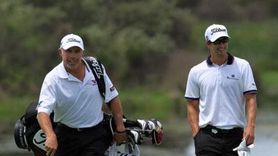 Steve Williams, left, has put his employer Adam Scott, right, in an awkward position with some demanding that he fire him.