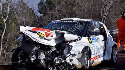The wrecked car of Robert Kubica is towed away following the crash.