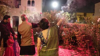 Sandeep and his wife Monisha Bhargava celebrate Diwali at home with their two daughters Mia, 2, and Arya, 4. Anna Nielsen / The National.