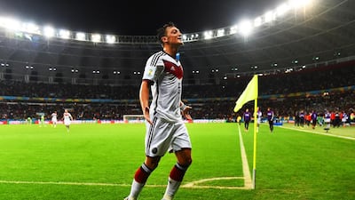 Even with the successes Germany has had on the pitch, midfielder Mesut Ozil has bore the brunt of criticism for what some people say is a disinterested or lazy attitude. Patrik Stollarz / AFP