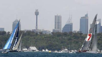 Australian supermaxi yacht Wild Oats XI (R) leads ahead Skandia at the start of the annual Sydney to Hobart yacht race.