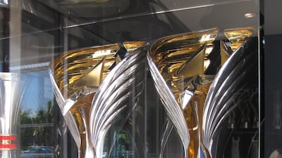 The trophies for Max Verstappen and for the team from the 2021 Abu Dhabi Grand Prix, which Verstappen won to take the world title. Photo: Daniel Bardsley for The National