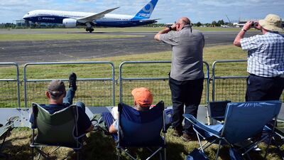 A Boeing 787-9 lands after a flight demonstration at the Farnborough air show on July 14, 2014. Emirates is weighing the 787-9 and -10 variants against the Airbus A350-900 and -1000 variants. Carl Court / AFP