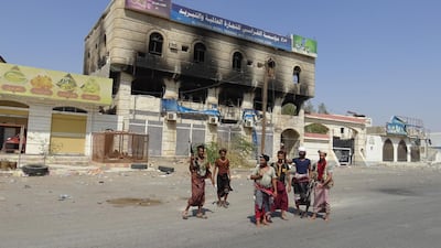 Yemeni pro-government troops stand in front of a damaged building during military operations against the Houthi rebels in the port city of Hodeidah, Yemen. EPA/STRINGER