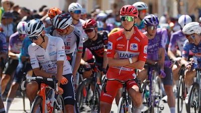 Tadej Pogacar, right, at the start line of Saturday's stage. EPA