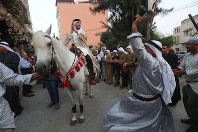Palestinians celebrate a traditional wedding day called Zaffa during Palestine Heritage Day in the West Bank village of Anabta. EPA