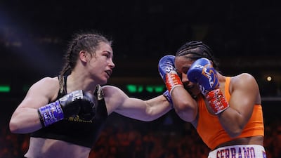 Katie Taylor lands a left hook on Amanda Serrano. AFP