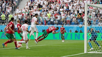 Match 3: Morocco's Aziz Bouhaddouz scores an own goal against Iran. Reuters