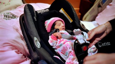Readers call for a law requiring the use of child safety seats. Delores Johnson / The National