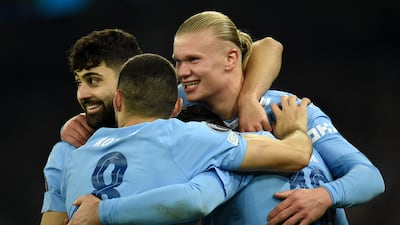 Erling Haaland celebrates with teammates after scoring his second goal. EPA