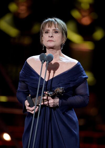 Patti LuPone accepts her best supporting actress award for 'Company'. Getty Images