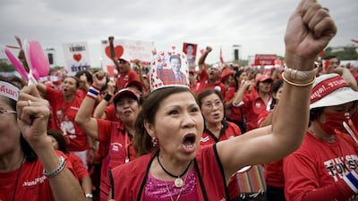 Red Shirt supporters of fugitive former premier, Thaksin Shinawatra, rally in Bangkok in 2009, above, in a call for him to be given a royal pardon. Nicolas Asfouri / AFP