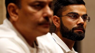 India's cricket team captain Virat Kohli and head coach Ravi Shastri listen to a question during a news conference in Mumbai, India July 19, 2017. Danish Siddiqui / Reuters