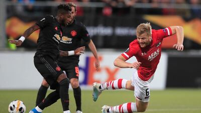 Manchester United's Fred, left, and Alkmaar's Fredrik Midtsjo. Associated Press