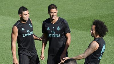Real Madrid's Marcelo, Casemiro and Raphael Varane share a joke during the training session. Javier Soriano / AFP