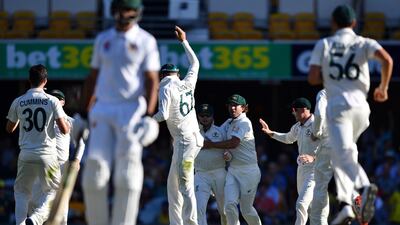 Australia's players celebrate the dismissal of Pakistan's batsman Asad Shafiq. AFP