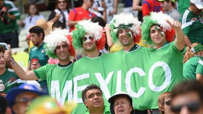 Mexican supporters cheer for their team ahead of the last-16 match against Netherlands on Sunday at the 2014 World Cup in Fortaleza, Brazil. Emmanuel Dunand / AFP