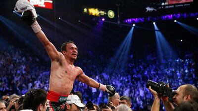 Juan Manuel Marquez celebrates his win over Manny Pacquiao following their WBO world welterweight fight. Eric Jamison / AP Photo