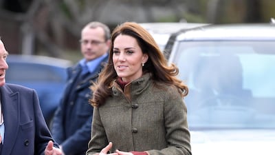 The Duchess of Cambridge wears a Dubarry tweed jacket, with a J Crew turtleneck, Zara trousers, See by Chloe boots and Kiki McDonough earrings as she visits King Henry's Walk Garden in London, England on January 15. Wireimage