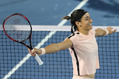 Caroline Garcia of Spain celebrates after she beats Lucie Safarova of Czech Republic during the Dubai Duty Free Tennis Championship in Dubai. Kamran Jebreili / AP Photo