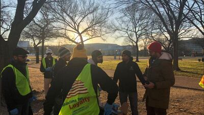 Members of the Ahmadiyya Muslim Youth Association clean up the National Mall in Washington DC