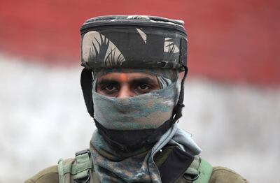 An Indian paramilitary soldier stands guard during a foreign delegation's visit in Srinagar. EPA