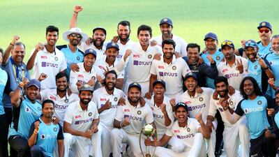India celebrate with the Border-Gavaskar Trophy after beating Australia to win the series at the Gabba on Tuesday, January 19. EPA