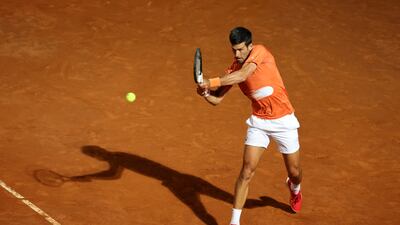 Novak Djokovic plays a backhand to Casper Ruud during the Italian Open semi-finals. Getty