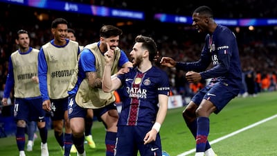 Khvicha Kvaratskhelia celebrates with teammates after scoring PSG's second goal. EPA