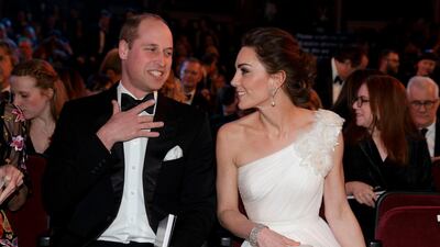 Prince William, Duke of Cambridge, and Catherine, Duchess of Cambridge, settle in their seats at the British Academy Film Awards 2019. AFP