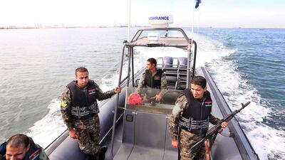 Libyan coastguards patrol on a boat off a maritime base in Tripoli on November 5, 2015, in a bid to stop people smugglers from exploiting migrants trying to reach Europe via the Mediterranean sea from Libya. Mahmud Turkia/AFP Photo
