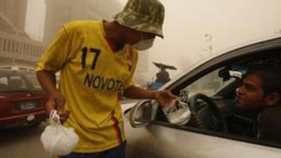 A man sells paper mouth masks in Baghdad.