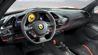Carbon is all over the interior, alongside lashings of Alcantara. Ferrari