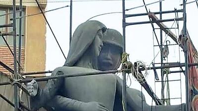 A sculpture, titled 'Mother of the Martyr', depicts a slender peasant woman, a traditional artistic representation of Egypt, with her arms outstretched while a helmeted soldier stands behind her with his arms wrapped around her waist, at a public square in Sohag, Egypt. Social media is abuzz, saying it appears to depict an unwanted advance on a woman. Mahmoud Ahmed/AP Photo