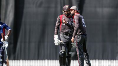 UAE players consult in the field against the USA. Antonie Robertson / The National