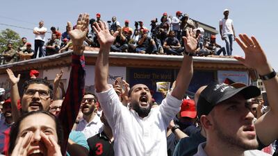 Jordanian protesters chant slogans during an anti-austerity rally on June 6, 2018, in front of the Labor Union offices in Amman. Ahmad Gharabli / AFP