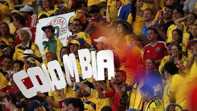 Colombia's fans celebrate after their team won their 2014 World Cup Group C match against Ivory Coast on Thursday in Brasilia, Brazil. David Gray / Reuters / June 19, 2014