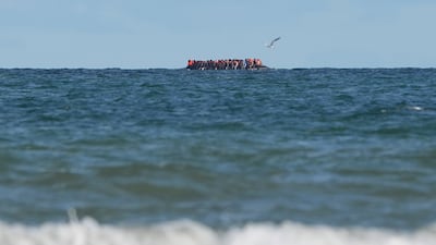 Migrants on board a small boat off the coast of Dunkirk, France. PA