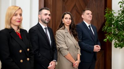 Dignitaries accompanying Milojko Spajic, Prime Minister of Montenegro (not shown), attend a memorandum of understanding exchange ceremony during a meeting at Al Shati Palace
